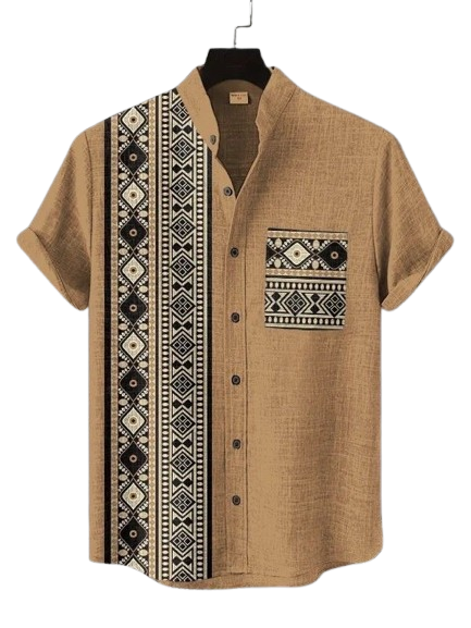 Man wearing sunglasses and embroidered floral tunic in a retail setting.